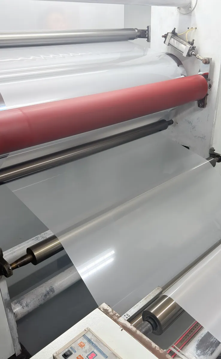 PET film web running over the rollers of a coating line