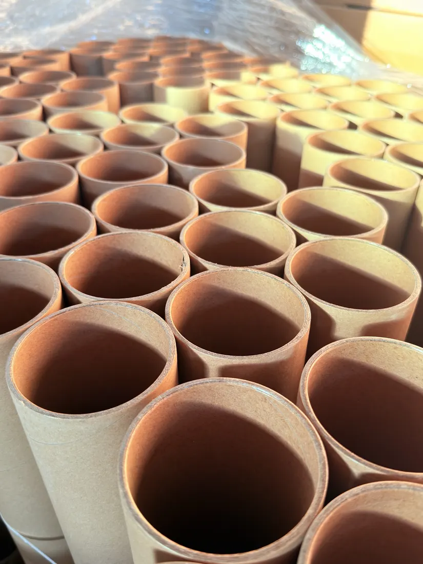 Stacks of paper cores in bulk, viewed end on