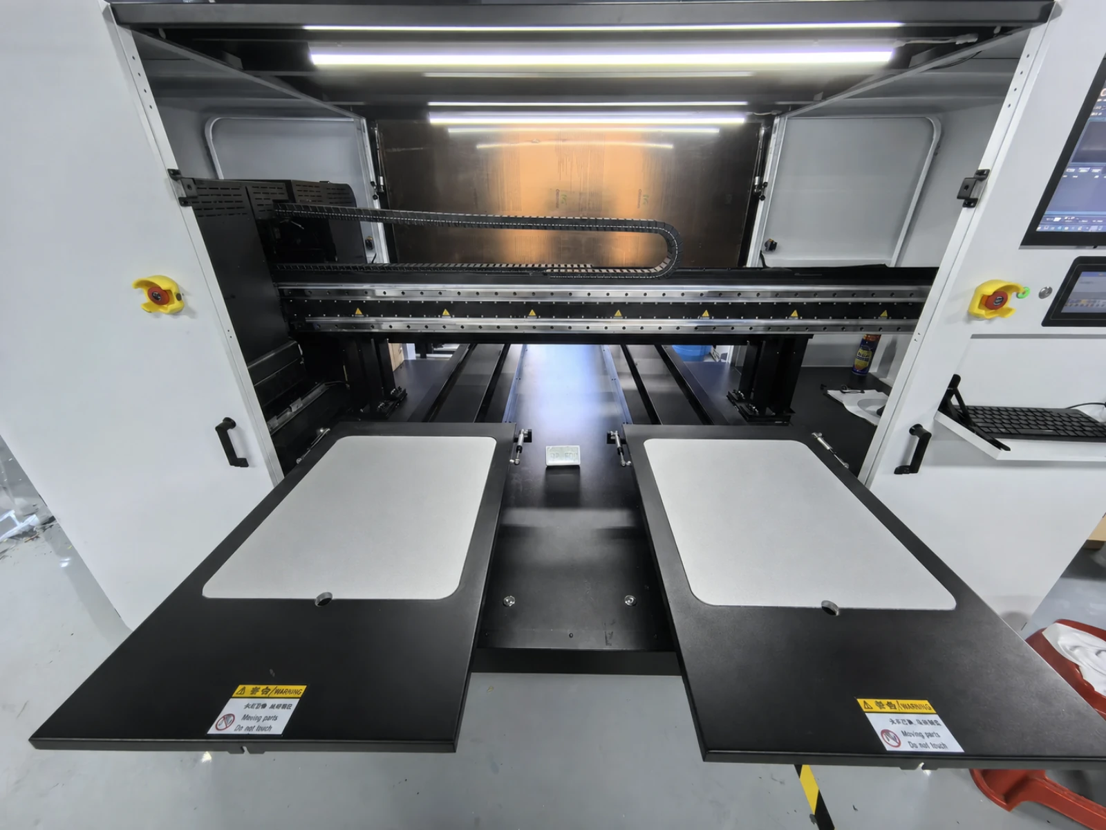 HY 2D DTG dual-platen loading area with both garment platen stations extended