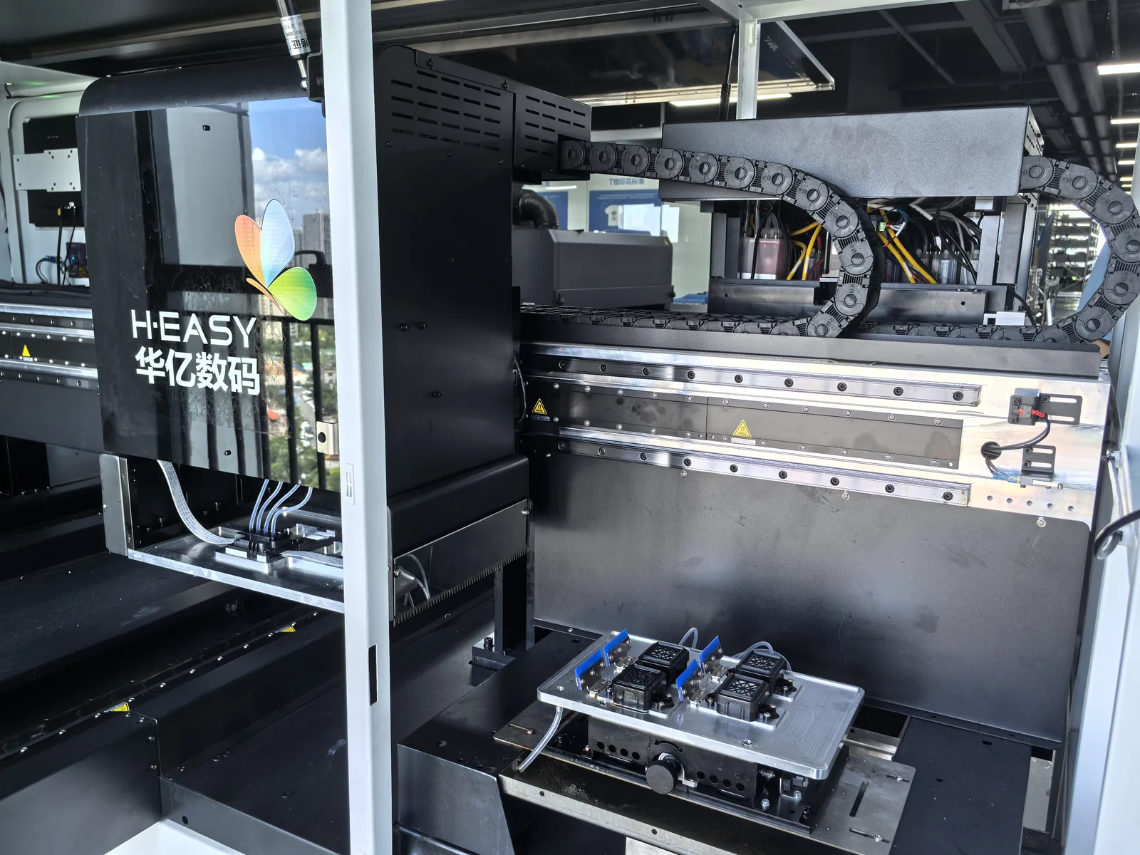 Interior view of the HY 2D DTG dual print carriages and maglev rail assembly