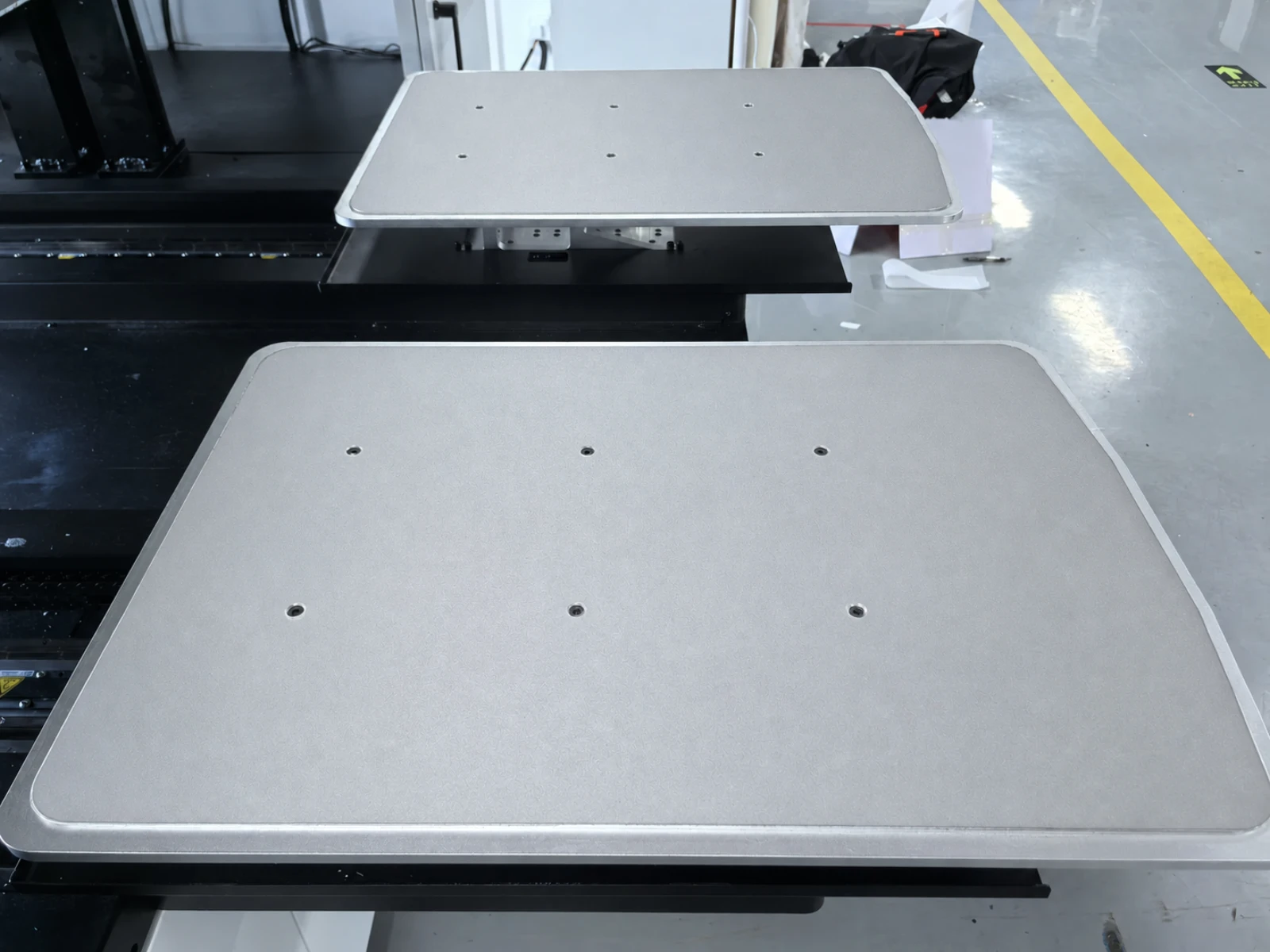 Two HY 2D DTG platen stations at the loading side