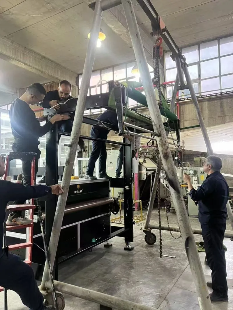 Installation team positioning the HY-1816 with lifting equipment inside the factory