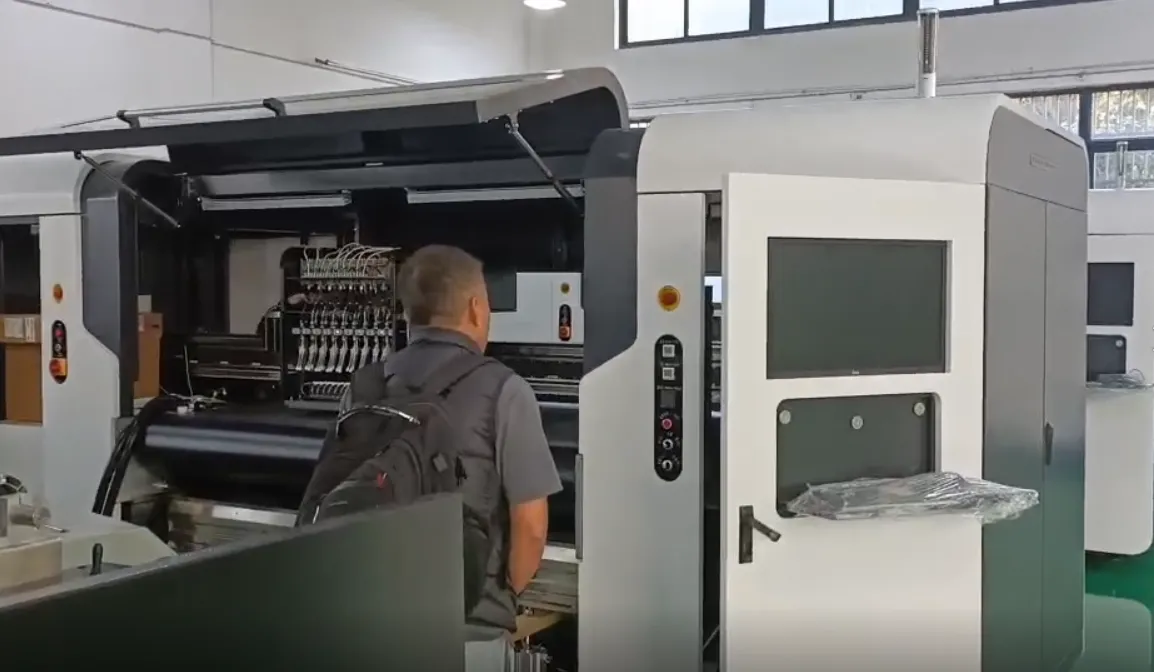 Vietnam customer inspecting a textile printer during a factory visit
