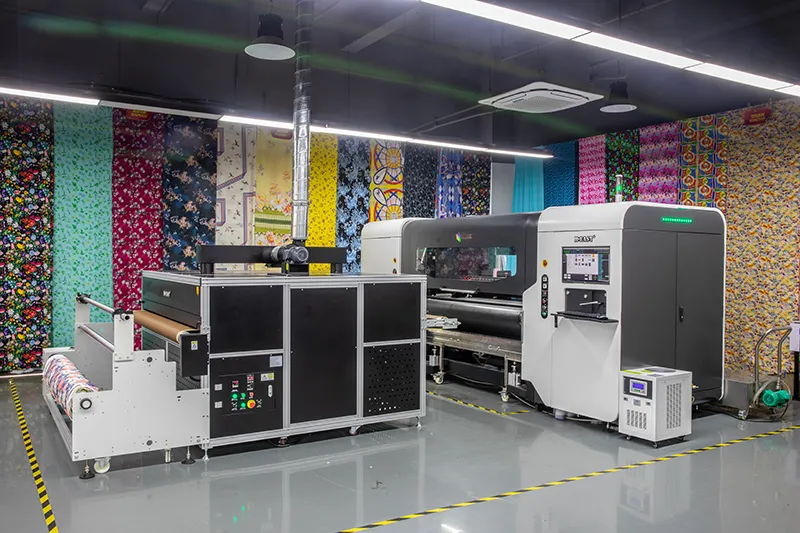 Roll-to-roll textile printer in a showroom surrounded by printed fabric samples